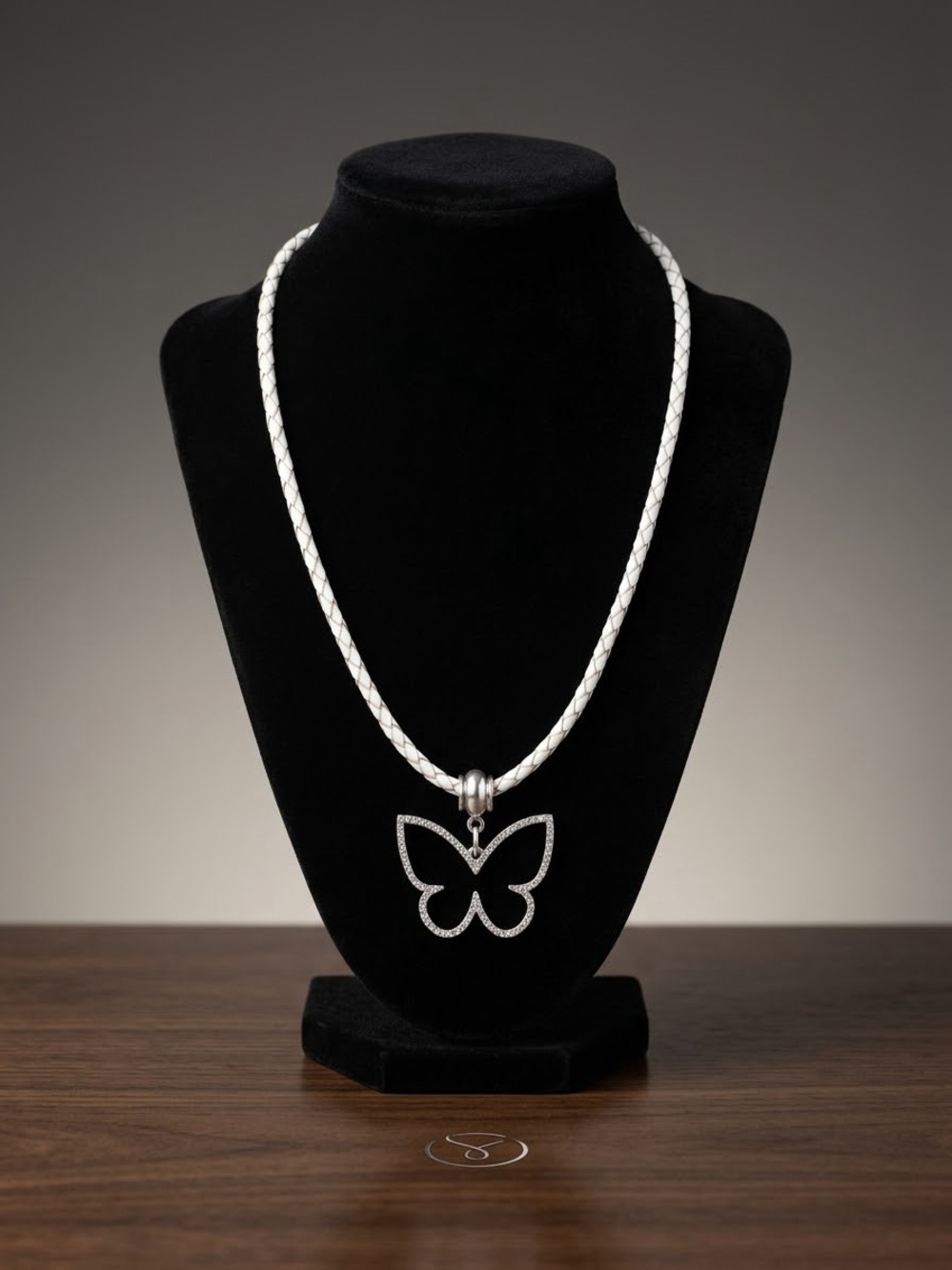 Crystal-Outline Butterfly Pendant on White Braided Necklace